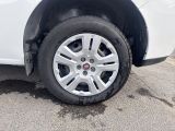 a white car that has a flat tire on it