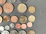 a lot of coins that are on the table