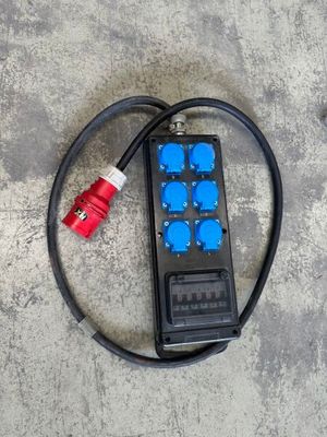a remote control sitting on top of a concrete floor