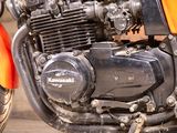 a close up of a motorcycle engine on a street