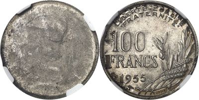 a close up of a silver coin with a white background