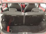 two seats in the back of a red car