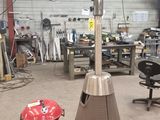 une photo d'un chauffage de terrasse au gaz dans un garage
