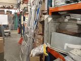 a ladder that is leaning against a wall in a warehouse
