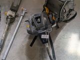 a backpack and tools on the floor in a room