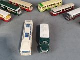 a lot of toy buses that are in a circle