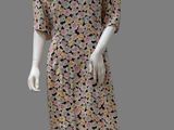 an image of a mannequin wearing a dress with flowers on it