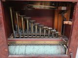 a wooden case with a musical instrument inside of it