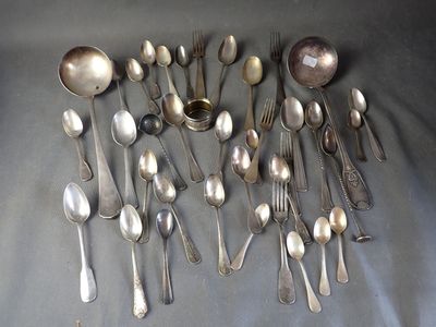 a lot of silver spoons and spoon spoons on a table