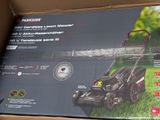 the box of the lawn mower is open and ready to be used