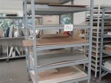 many shelves with different types of wood on them in a warehouse