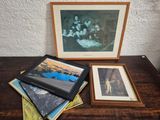 three framed pictures of a family sitting on top of a wooden table