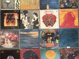 a lot of different album covers on the wall