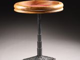 a small wooden table with a metal base and a wooden top