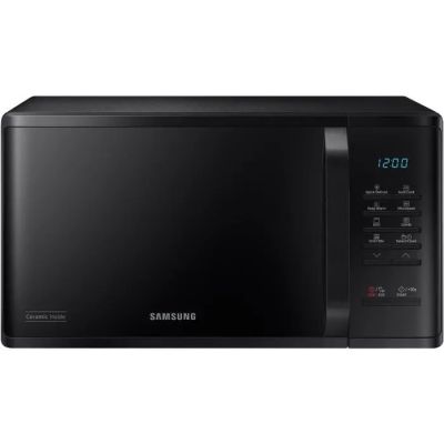 a black microwave oven sitting on top of a white counter