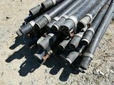 a lot of pipes that are laying on the ground