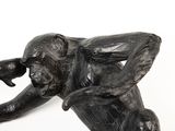a statue of a monkey that is sitting on a table