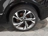 a close up of a tire on a black car