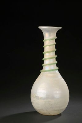 a glass vase with a spiral design on it