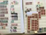 a lot of stamps on the pages of a book