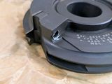 an image of a black plastic object on a piece of paper