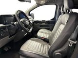 the interior of a truck with a leather seat and steering wheel