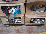two boxes with shoes in them sitting on the floor