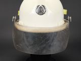 an image of a white hard hat on a black base