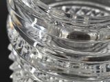 a close up of a clear glass vase on a table