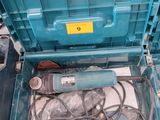 a blue box with wires and a drill in it
