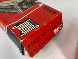 a box of cigarettes sitting on a table next to a box of cigarettes