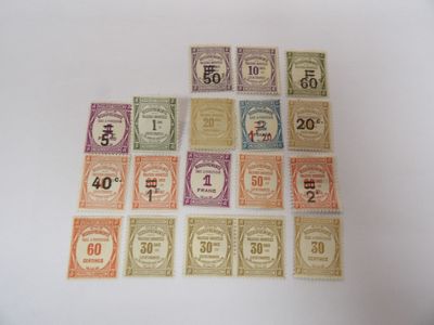 several different colored stamps with numbers on them on a white surface