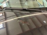 a car with a sticker on the hood of it