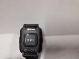 a close up of a smart watch sitting on a white surface