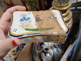 a person that is holding a small plate in their hand