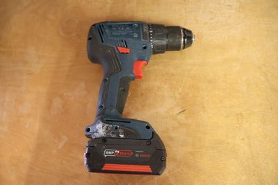 a cordless drill that is sitting on a table