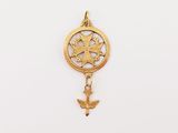 a close up of a gold charm with a bird on it