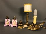a lamp that is sitting next to a couple of figurines