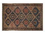un tapis bleu et marron orné d'un motif en losanges
