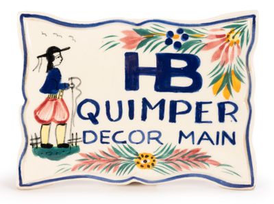 a close up of a ceramic plaque with a woman holding a cane