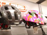 several helmets on display in a store for sale