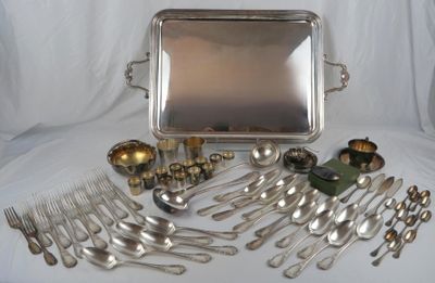 a lot of silver spoons and silverware on the table