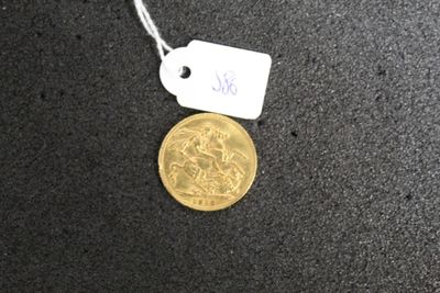 a gold coin with a price tag attached to it