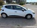 a picture of a small white car parked in a parking lot