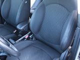 two black leather seats in the back of a car