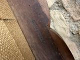 a close up view of a piece of wood on the floor