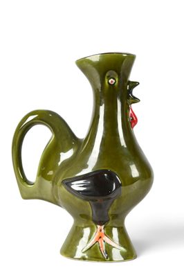 a green vase with a black bird on it