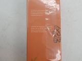 an orange box with a label on it sitting on a table