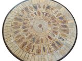 a wooden table with a circular design on it