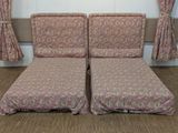 two couches that are sitting in the corner of a room